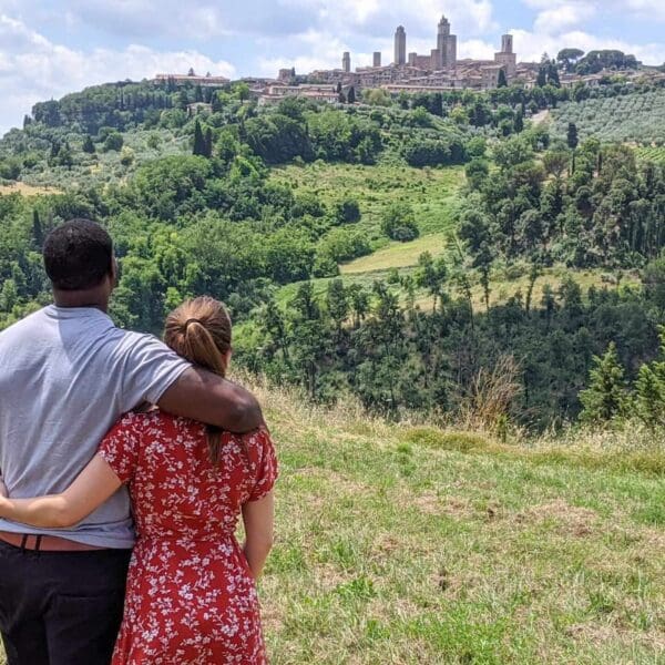 A couple looking at San Gimignano from far away