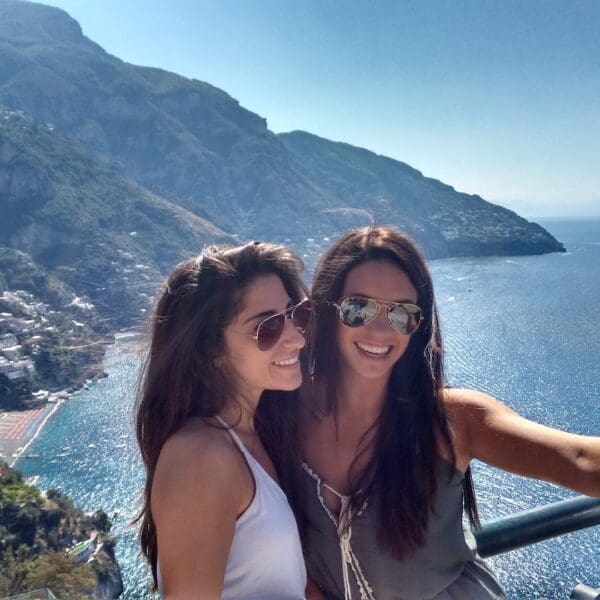 two friends taking a selfie with their phone