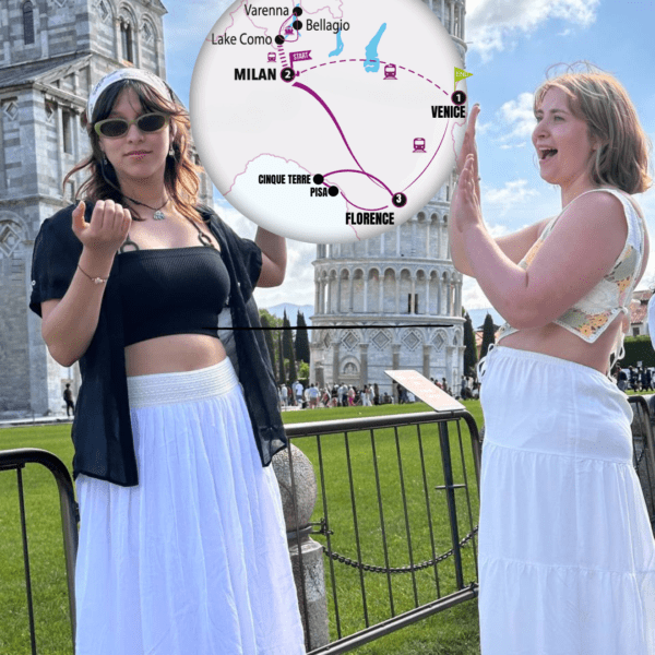 Two women with a map in between them showing the route for the "Let's Go North" trip