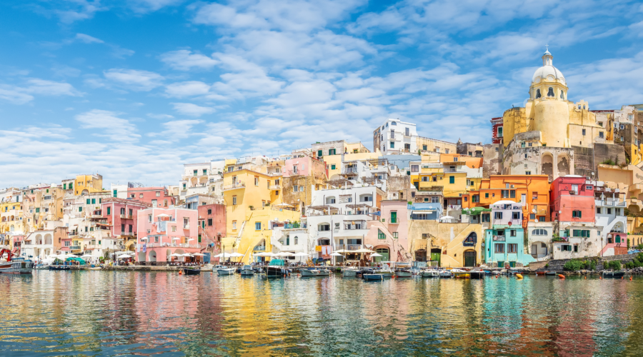 The view of the colorful houses of Procida from the water