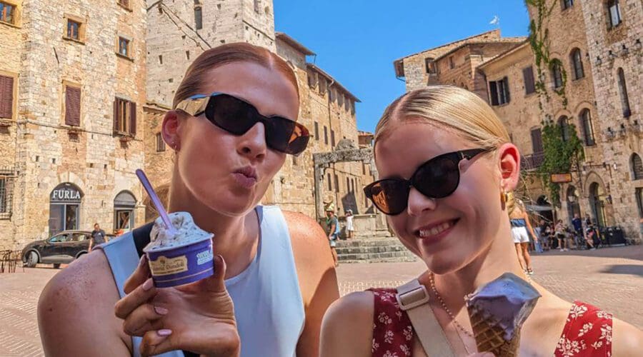 Two happy women with gelato in San Gimignano