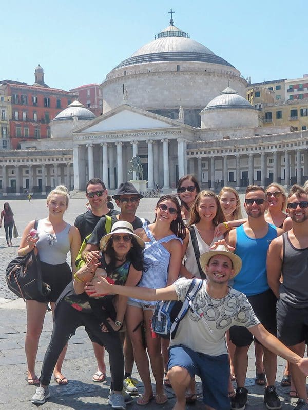A group standing in front of Piazza del Plebiscito