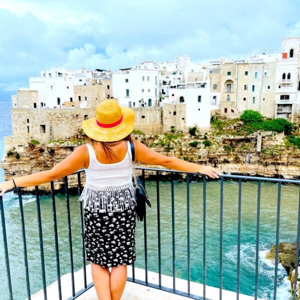 Woman looking out at Polignano e Mare in Puglia